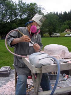 Tamara Buchanan, in her get up, carving toes on her turtle